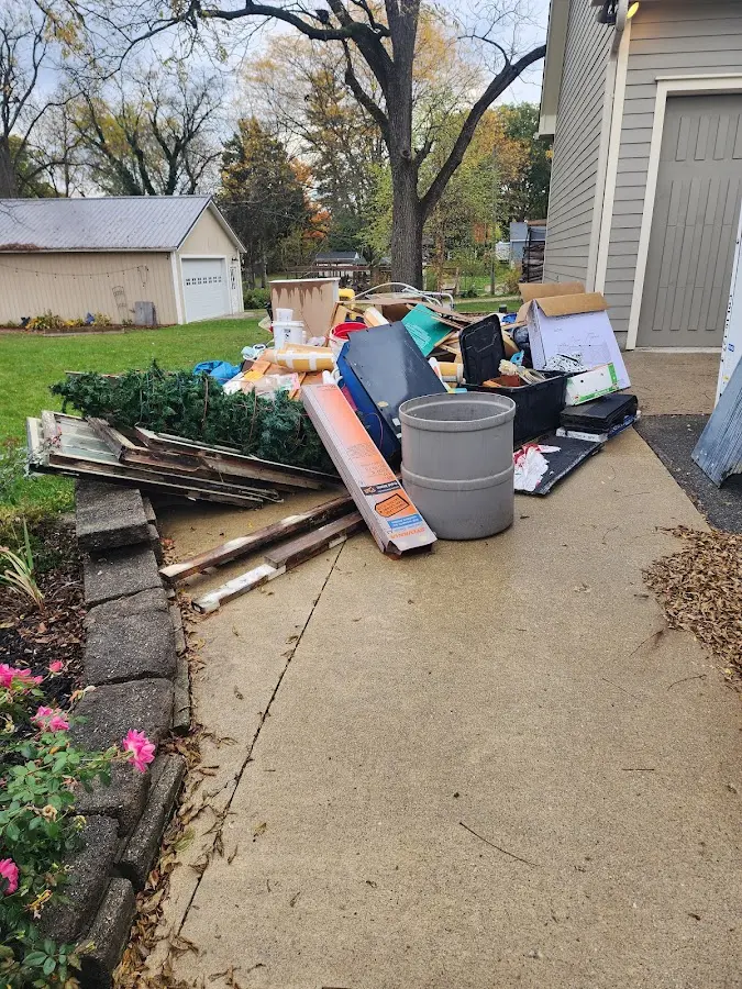 Dumpster being loaded with debris for Commercial Dumpster Rental in Harker Heights